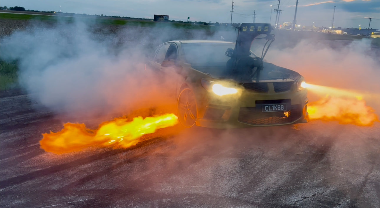 blown aussie burnout car shooting flames from boom tubes